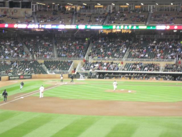 Ichiro's that running, blurry blob on the left there in between the fat umpire and even fatter first baseman.